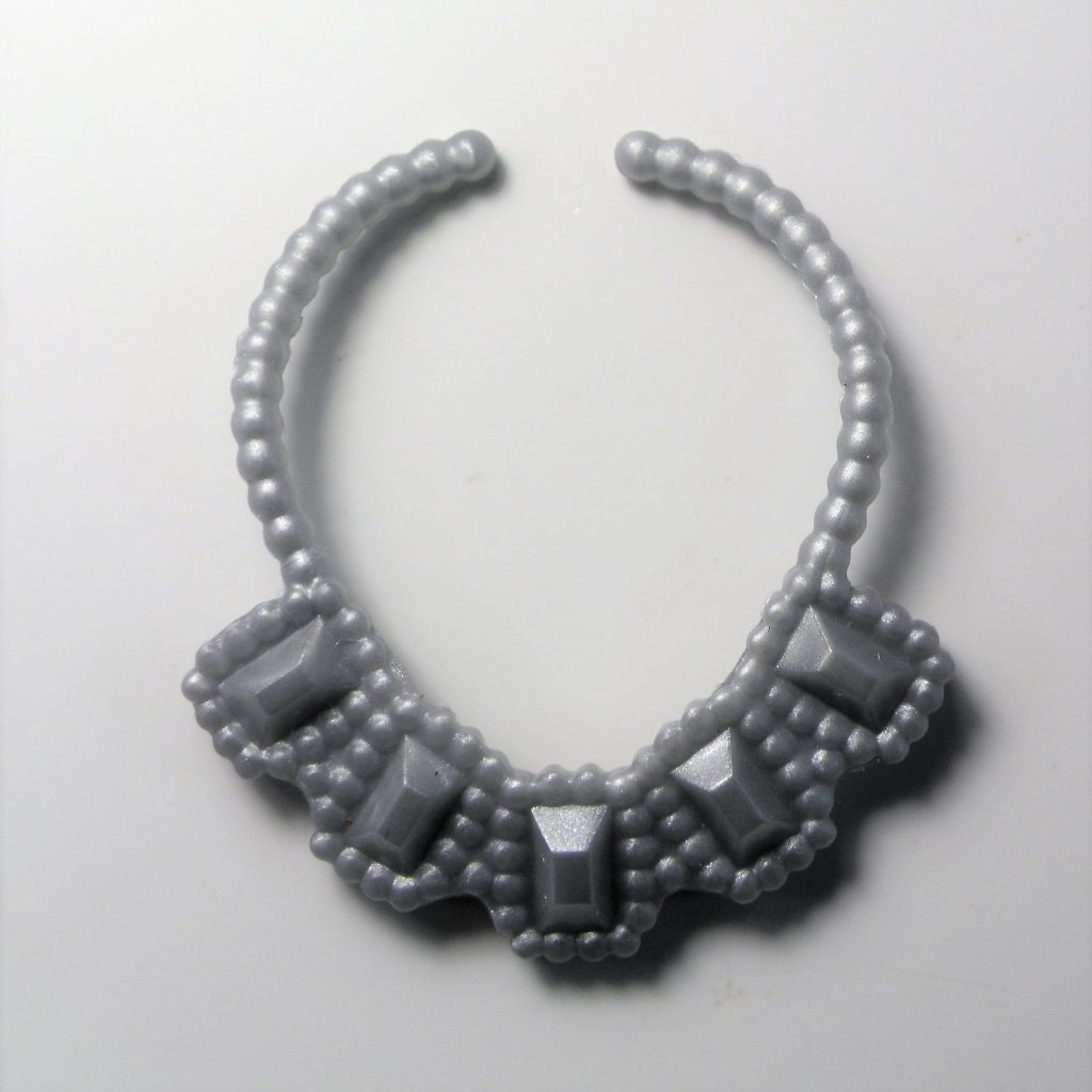 The silver necklace detail